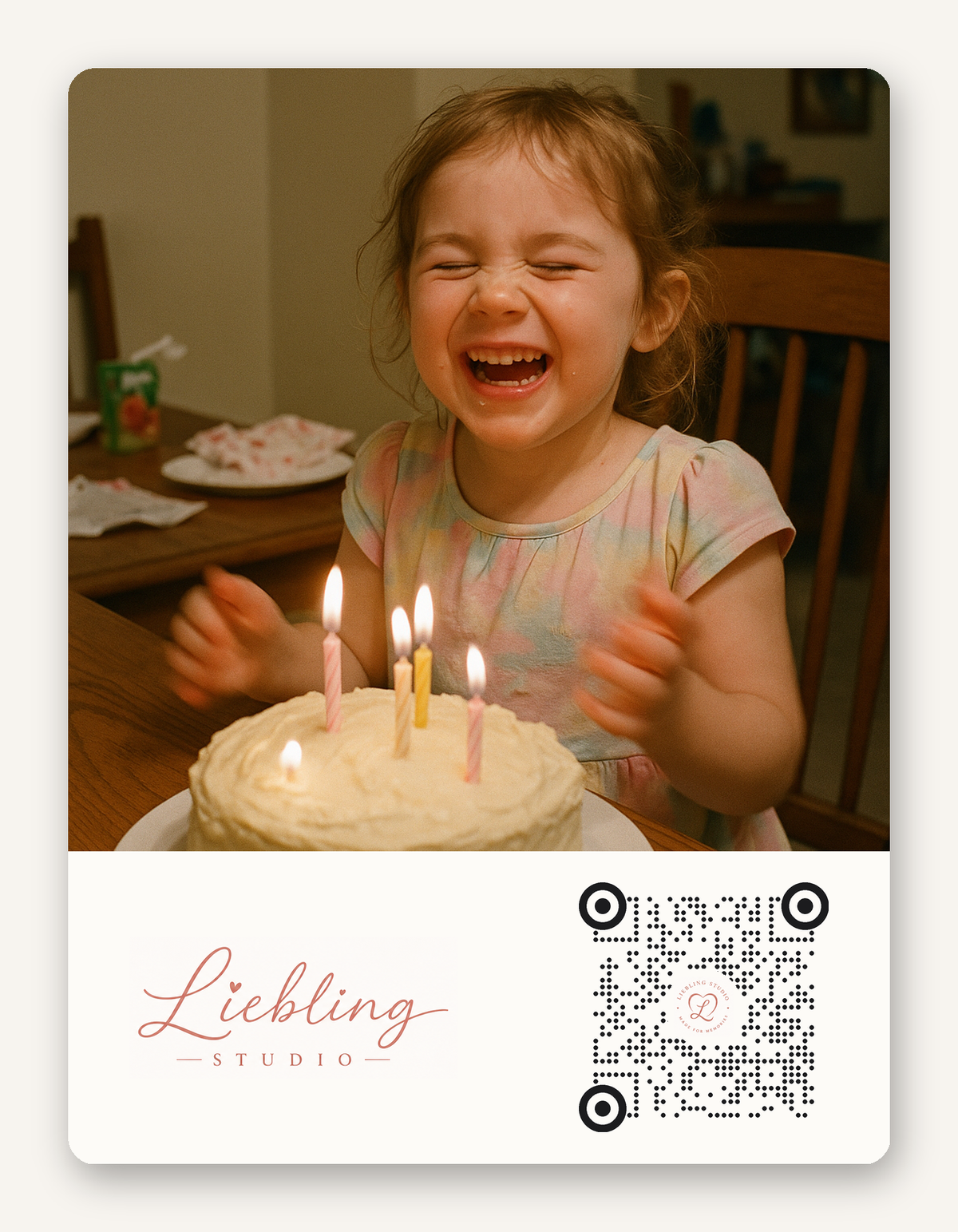 A square portrait photo of a young girl laughing joyfully behind a birthday cake with lit candles, with a white lower banner reading 'Liebling Studio' and a QR code. The photo appears to be a custom portrait print or card design.