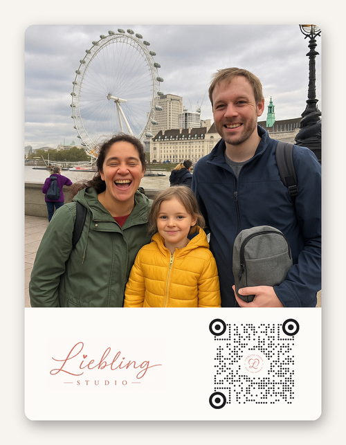 A square photo print featuring a family of three smiling in front of the London Eye, with a white lower section containing the text 'Liebling STUDIO' and a QR code.